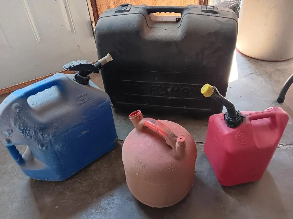 Assorted fuel containers and craftsman empty tool