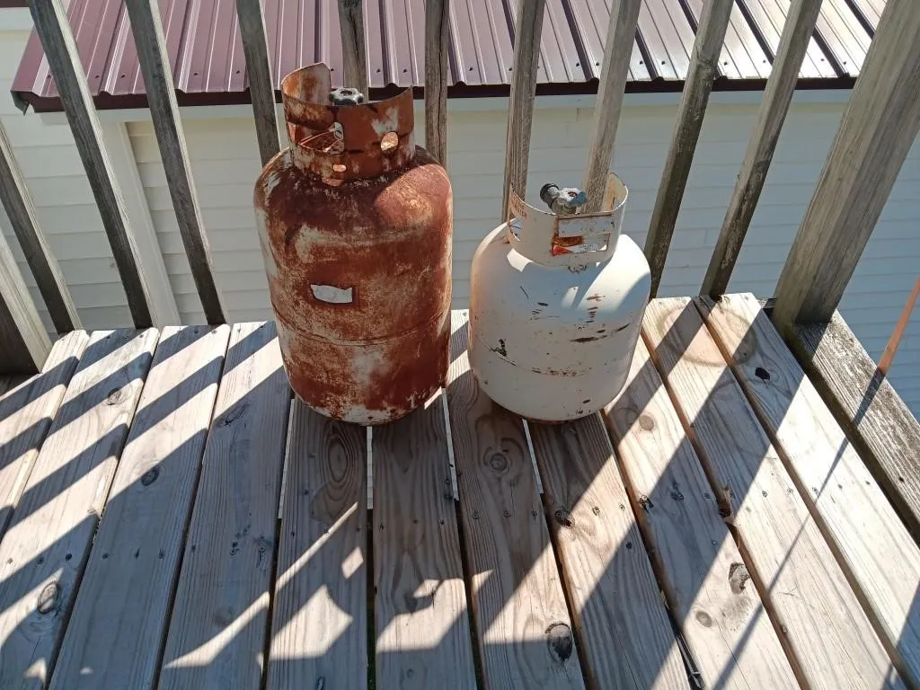Two Propane Tanks. Unsure If Tanks Contain Fuel.