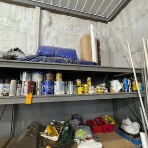 Shelf of Paint, Enamel, Primer, Stain, and More