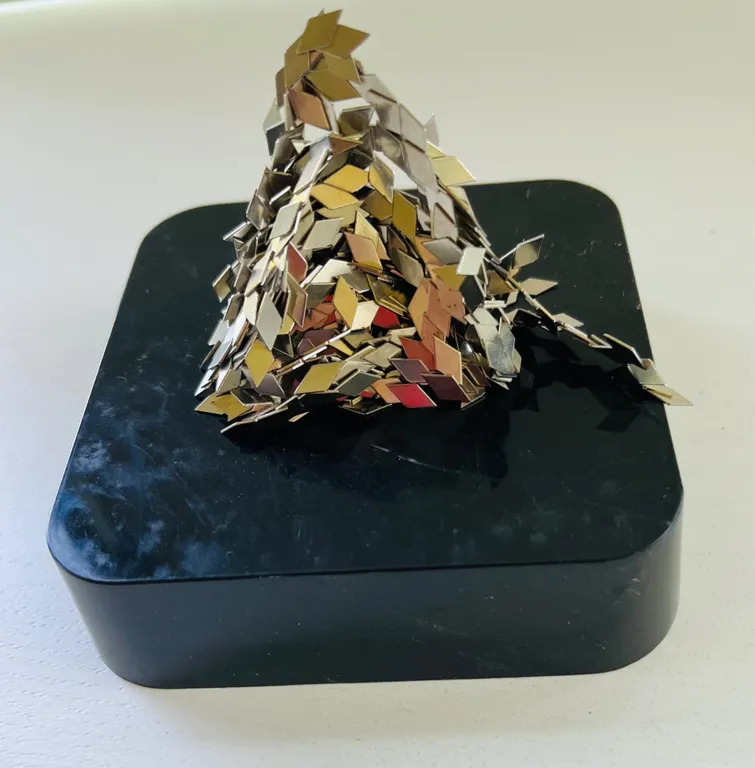 Metallic Diamond-Shaped Flakes on Black Base