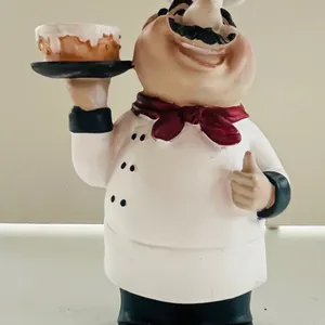 Chef Figurine Holding Cake