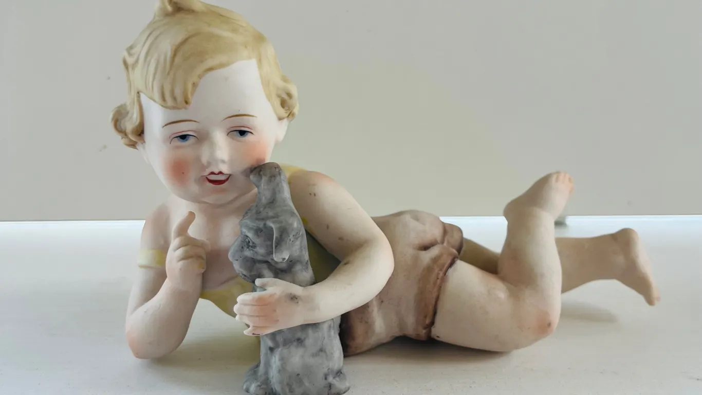 Antique German Porcelain Piano Baby Figurine