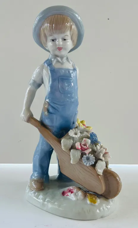 Porcelain Boy Figurine with Floral Wheelbarrow