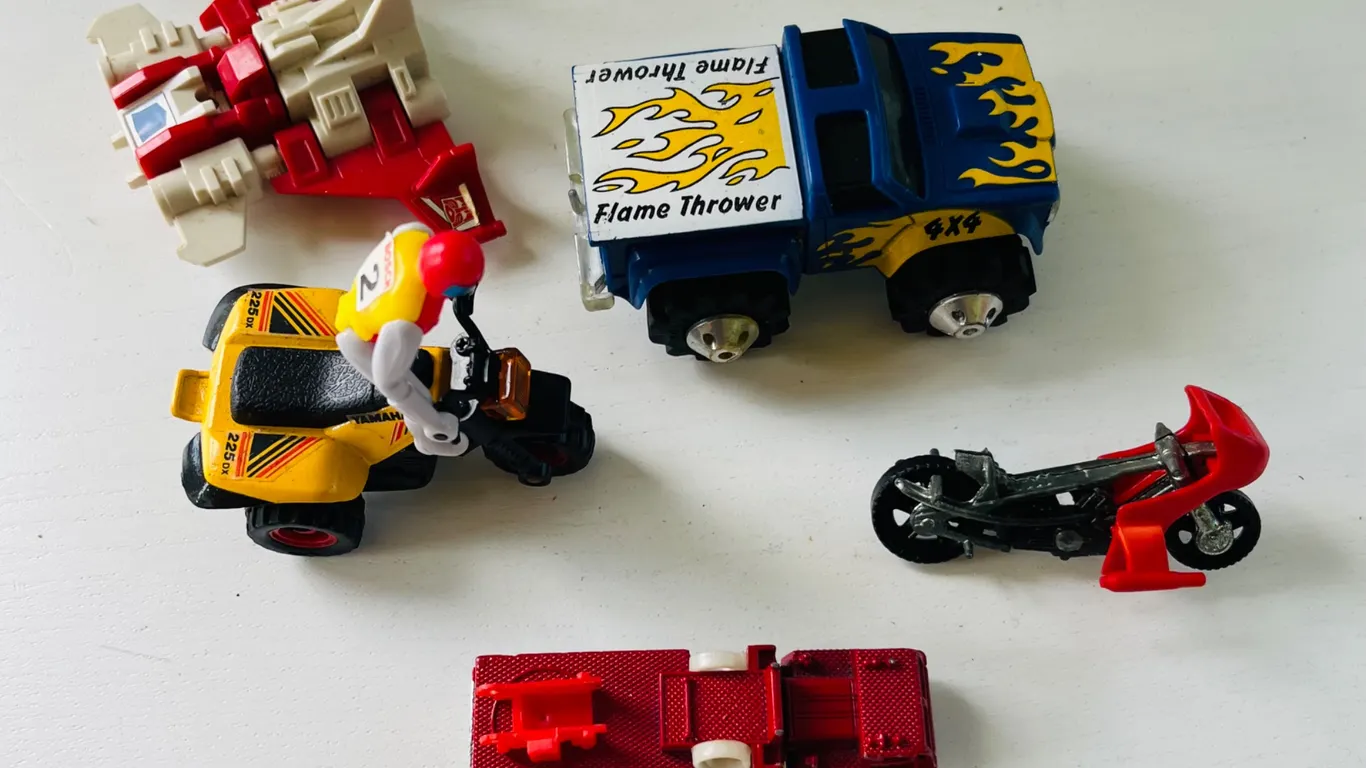 Assorted Toy Vehicles and Robot