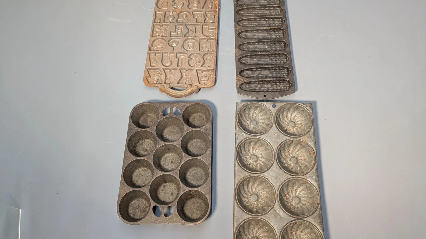 Collection of Four Cast Iron Baking Molds