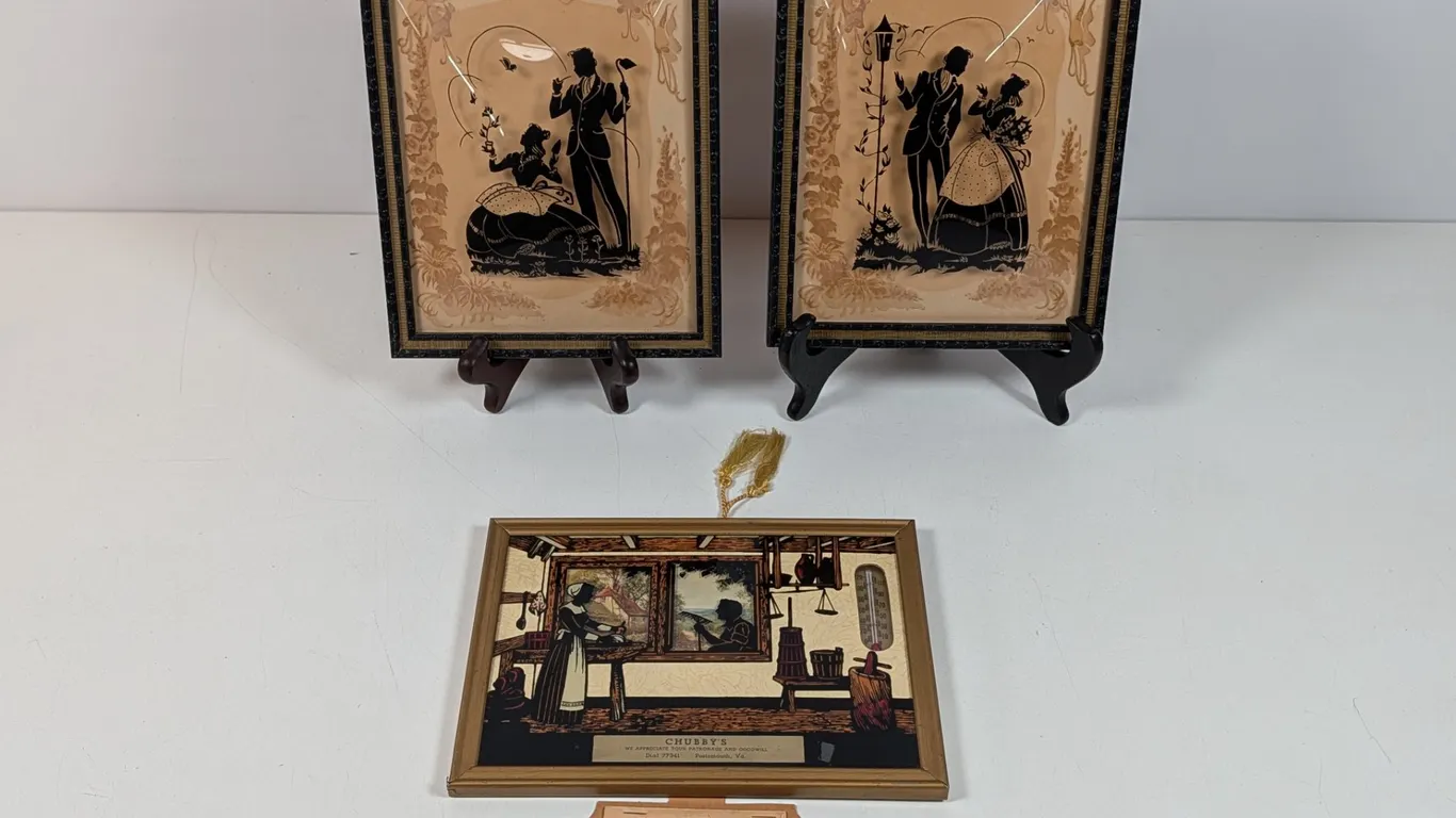 Framed Silhouettes and Vintage Thermometer Advertisement