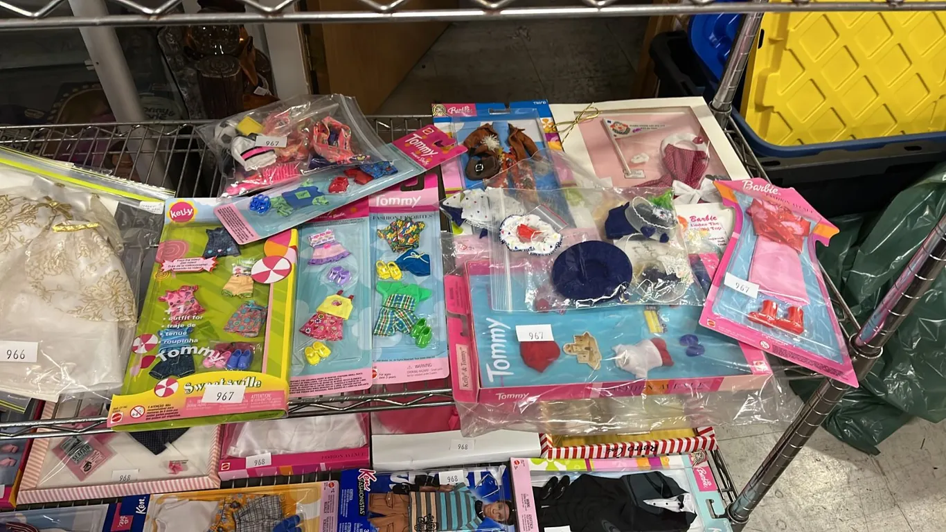 COLLECTION OF ASSORTED BARBIE CLOTHES *MOST ARE IN SEALED PACKAGES*