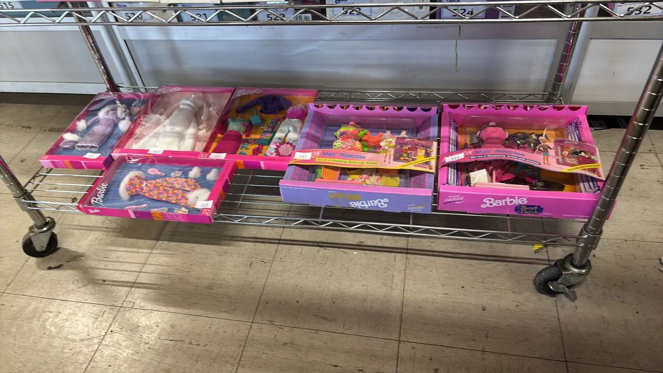SHELF OF ASSORTED VINTAGE BARBIE CLOTHINGS *IN ORIGINAL BOXES*