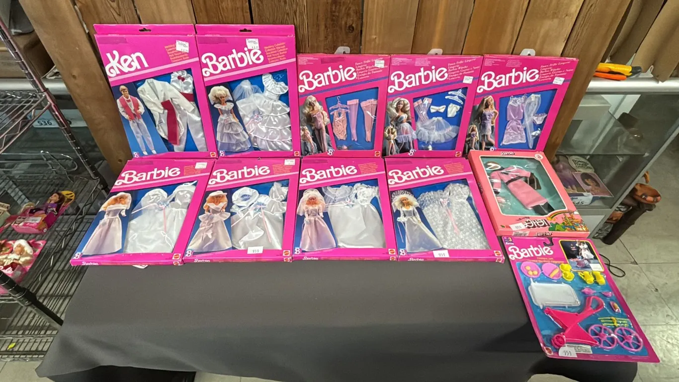 SHELF OF ASSORTED VINTAGE BARBIE CLOTHES