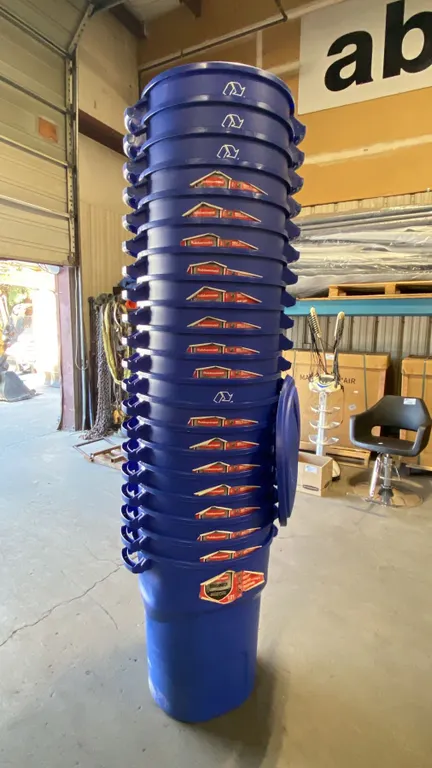 STACK OF 25 BLUE RUBBERMAID ROUGHNECK RECYCLE/TRASH BINS WITH LIDS- 32 GAL/ 121 L