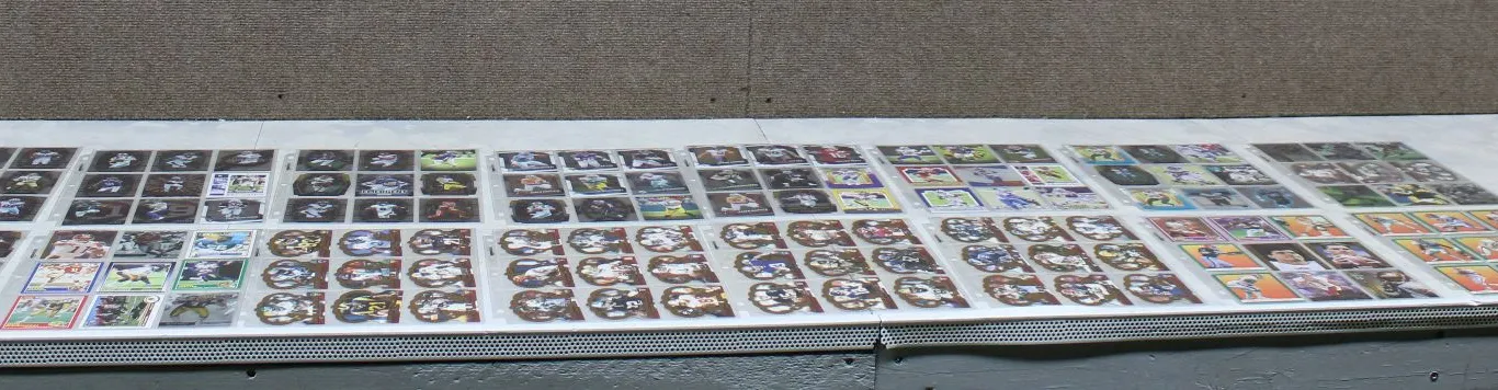 17 Pages of Football Cards Featuring Emmitt Smith, Brock Purdy, Clyde Edwards-Helaire