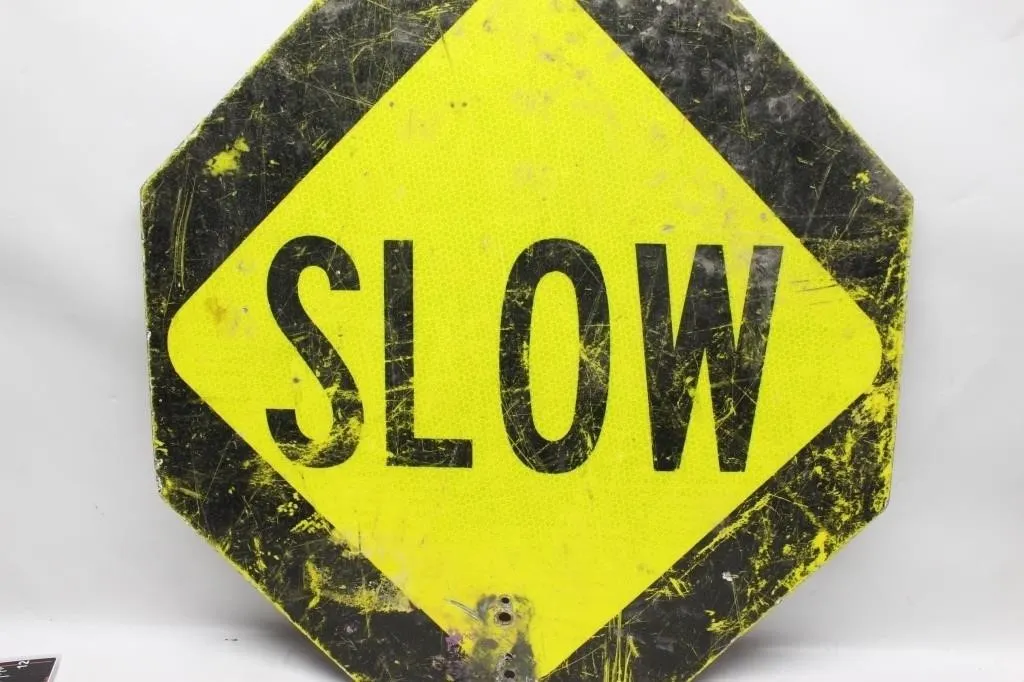 Slow and Stop road sign