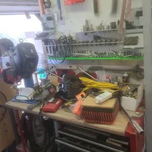 Customized Work Bench With Hand Welded Pulley, Crank Hoist, and Workshop Tools
