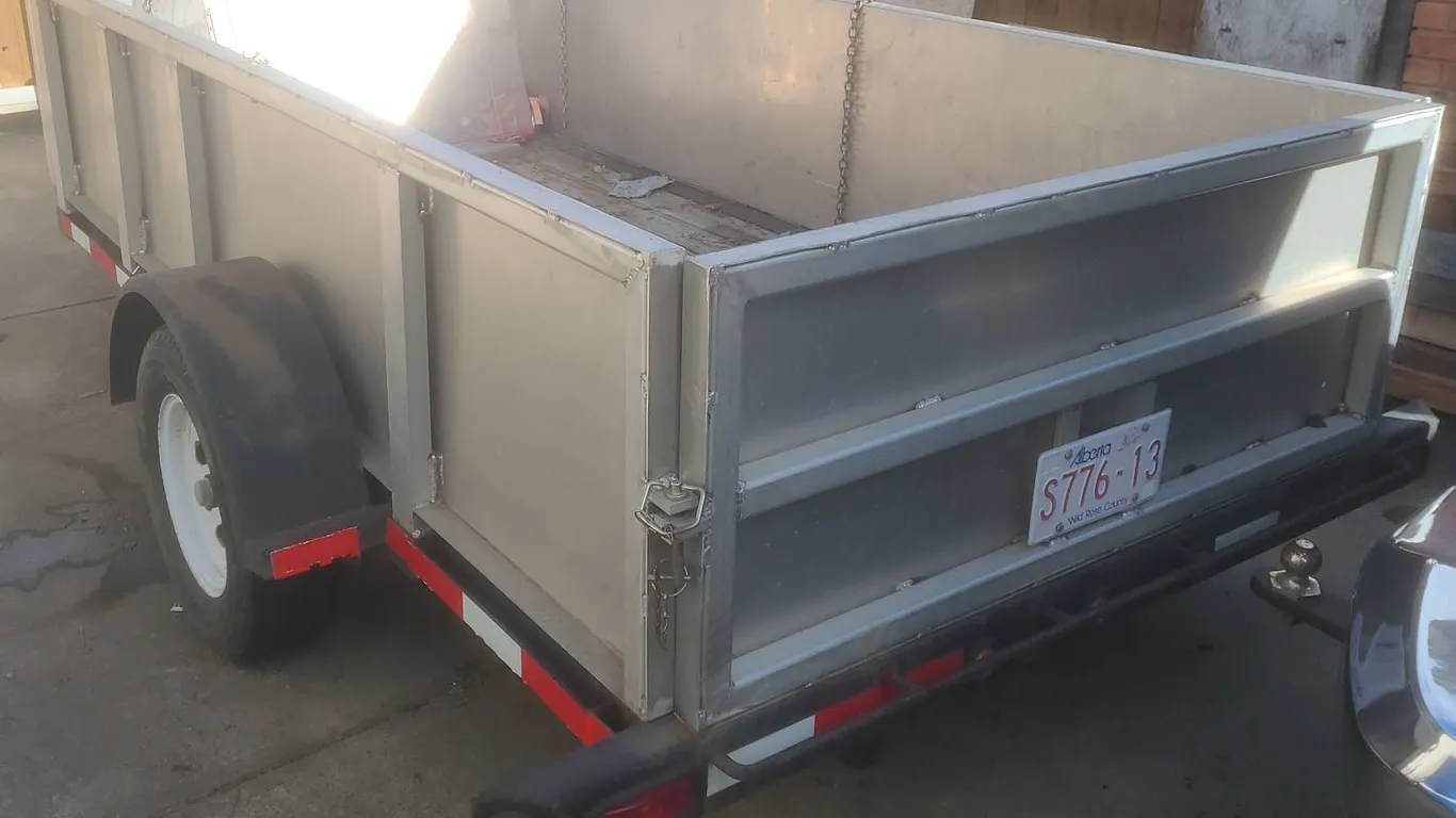 Open Utility Trailer with Aluminum Sides and Wood Deck