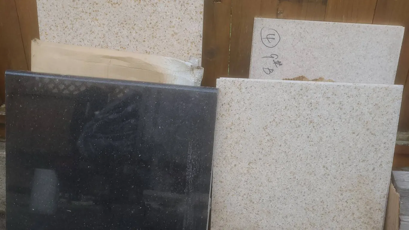 Granite Slabs – Polished Black and Speckled Light Stone