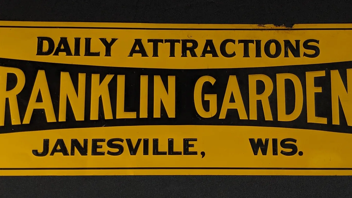 EMBOSSED TIN SIGN DAILY ATTRACTIONS FRANKLIN GARDENS JANESVILLE WISCONSIN