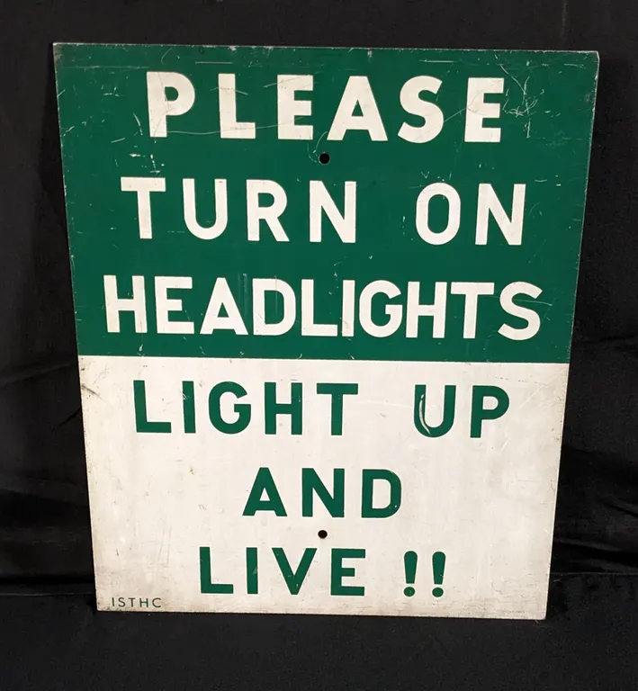 VINTAGE ROAD SIGN PLEASE TURN ON HEADLIGHTS LIGHT UP AND LIVE!