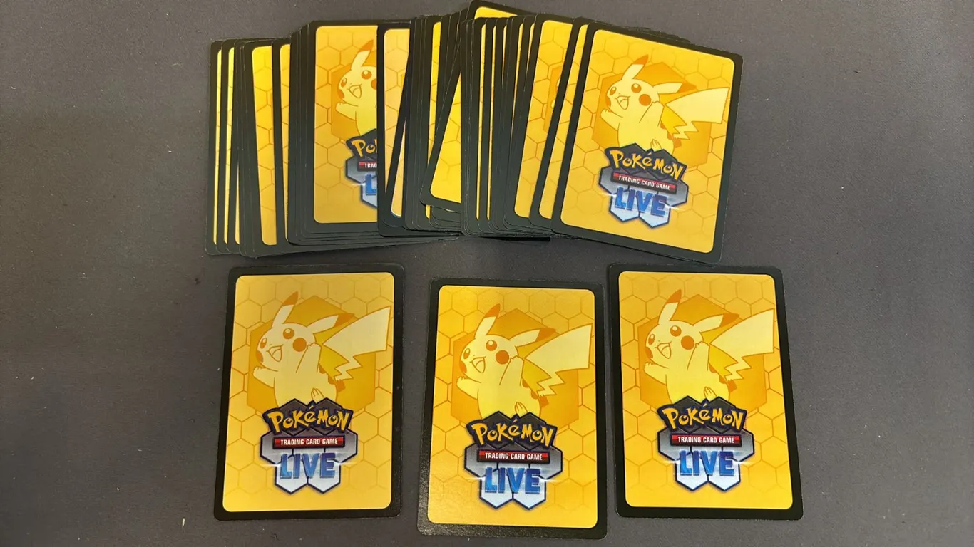 STACK OF POKEMON LIVE TRADING CARD GAME REDEMPTION CODES