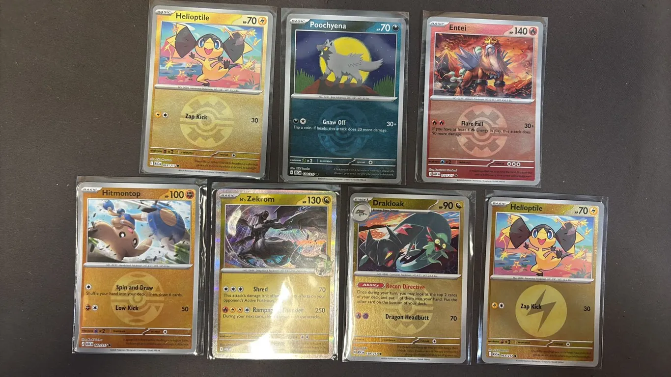 (7) ASSORTED POKEMON CARDS IN SLEEVES