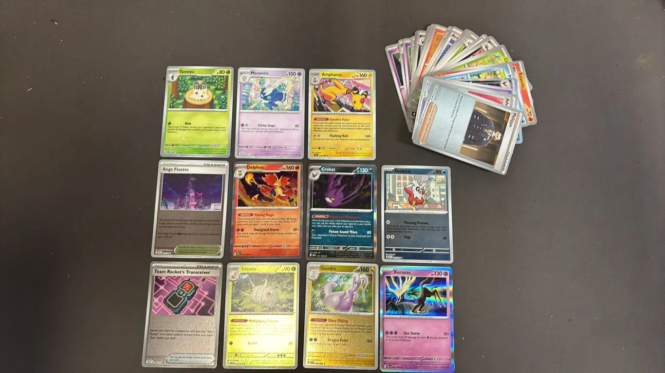 STACK OF ASSORTED POKEMON CARDS