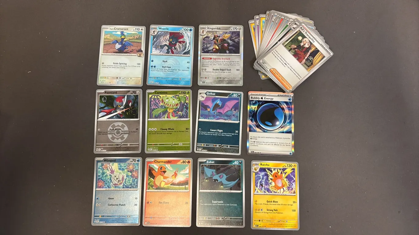 STACK OF ASSORTED POKEMON CARDS