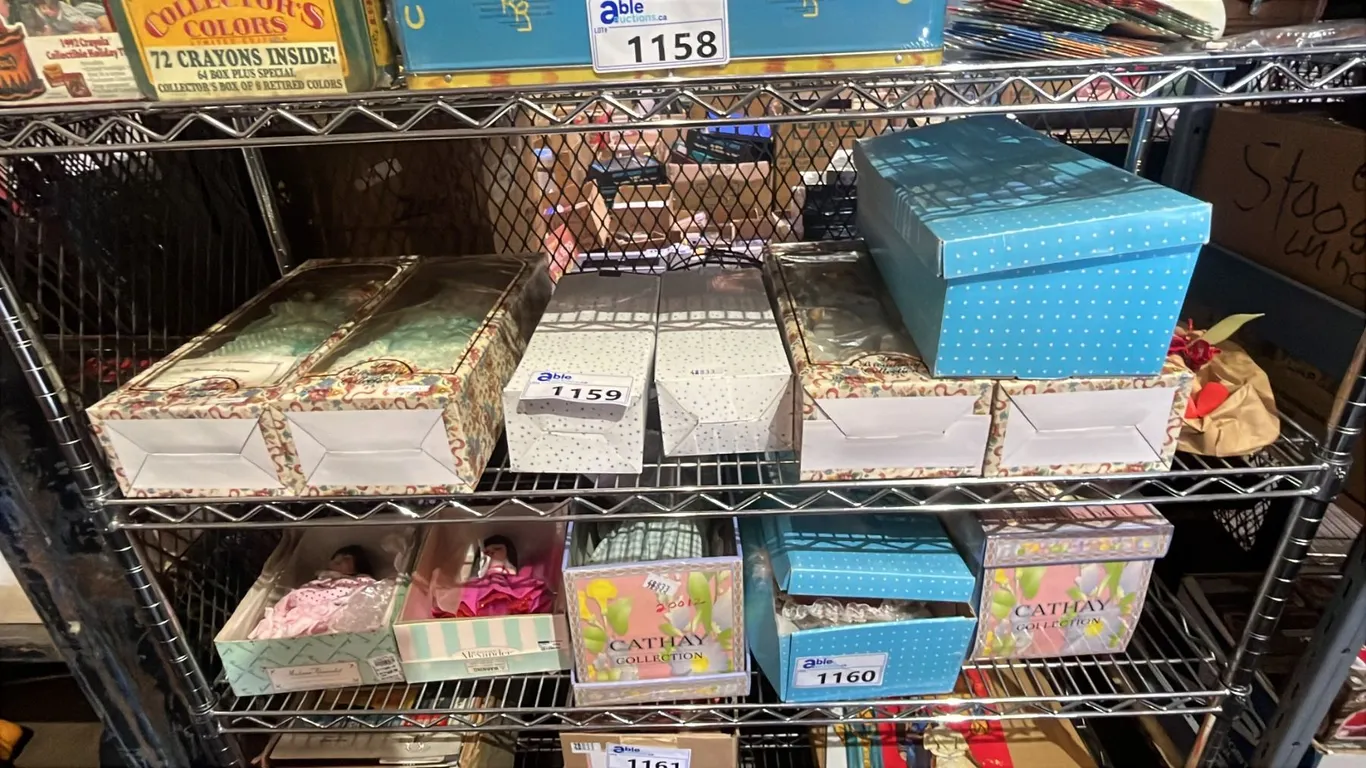 SHELF LOT OF ASSORTED DOLLS IN BOXES