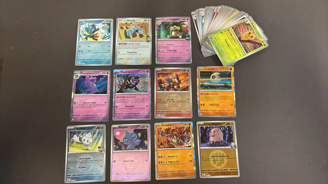 STACK OF ASSORTED POKEMON CARDS
