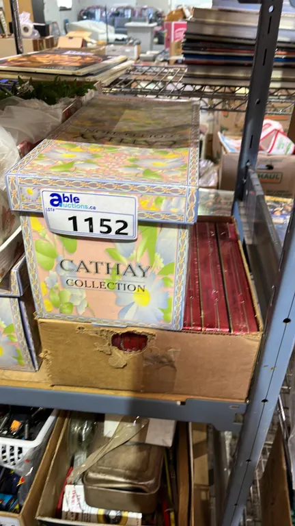 CATHAY COLLECTION PORCELAIN DOLL AND BOX OF VINTAGE RUSSELL STOVER COLLECTABLE CANDY TIN