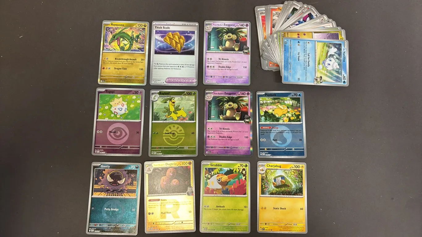 STACK OF ASSORTED POKEMON CARDS
