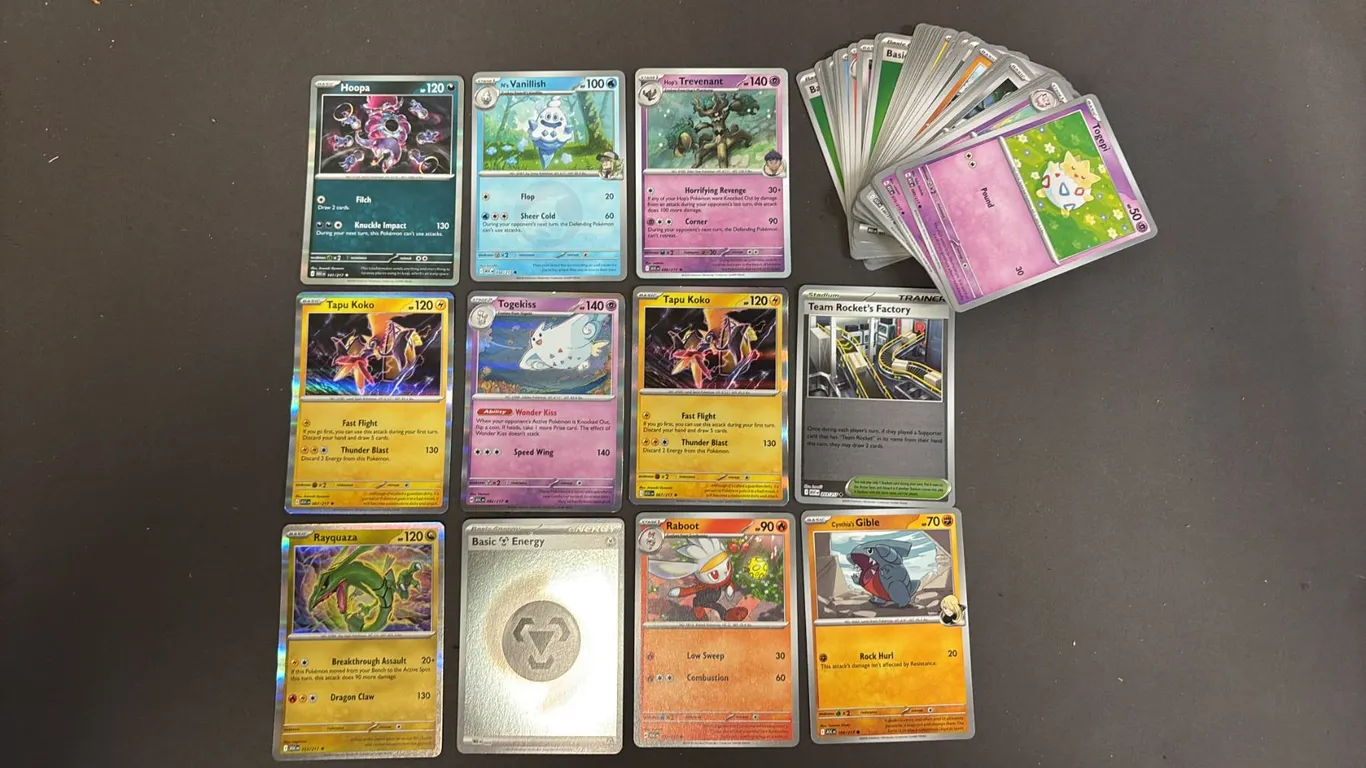 STACK OF ASSORTED POKEMON CARDS