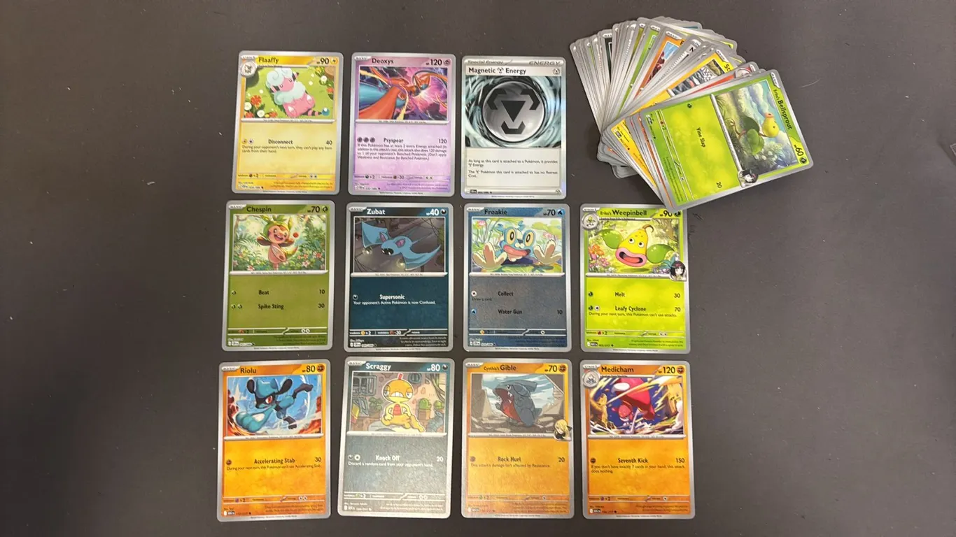 STACK OF ASSORTED POKEMON CARDS