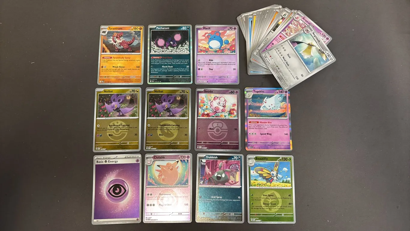 STACK OF ASSORTED POKEMON CARDS