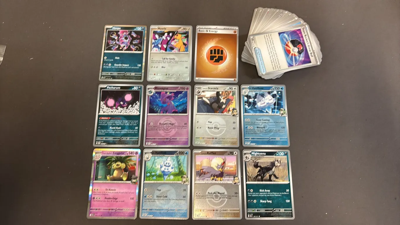 STACK OF ASSORTED POKEMON CARDS