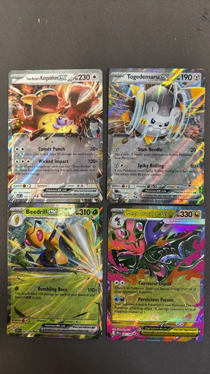 (4) ASSORTED POKEMON CARDS