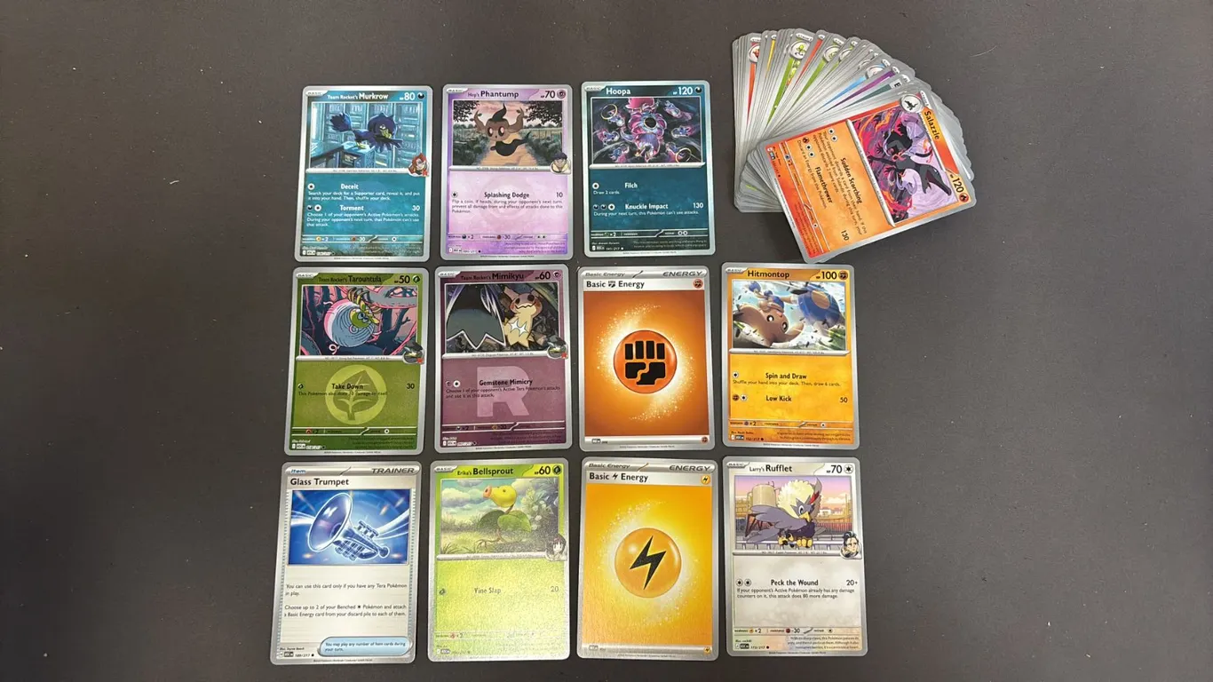 STACK OF ASSORTED POKEMON CARDS