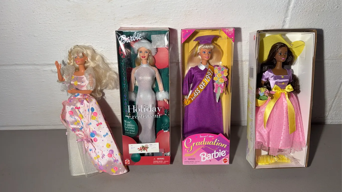 Four Barbie Dolls