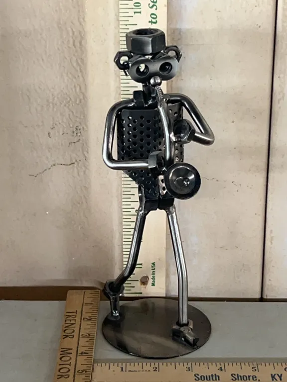 Metal Art Man Playing Instrument 9.75" Tall