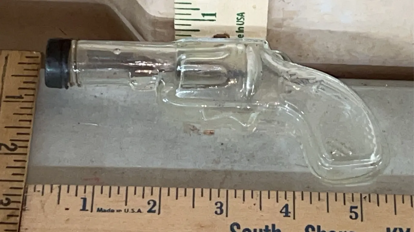 Vintage/Antique Clear Glass Revolver Candy Bottle Marked U.S.A. Avor 1 oz