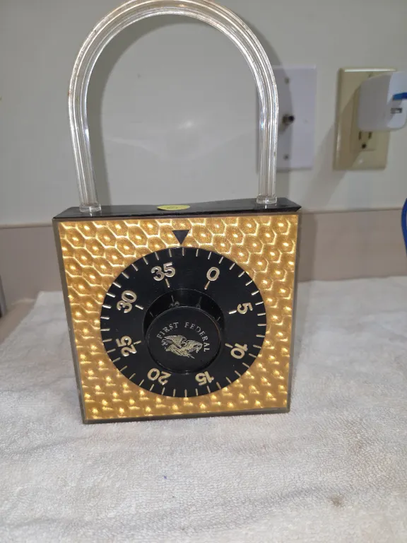 Vintage padlock shaped coin bank