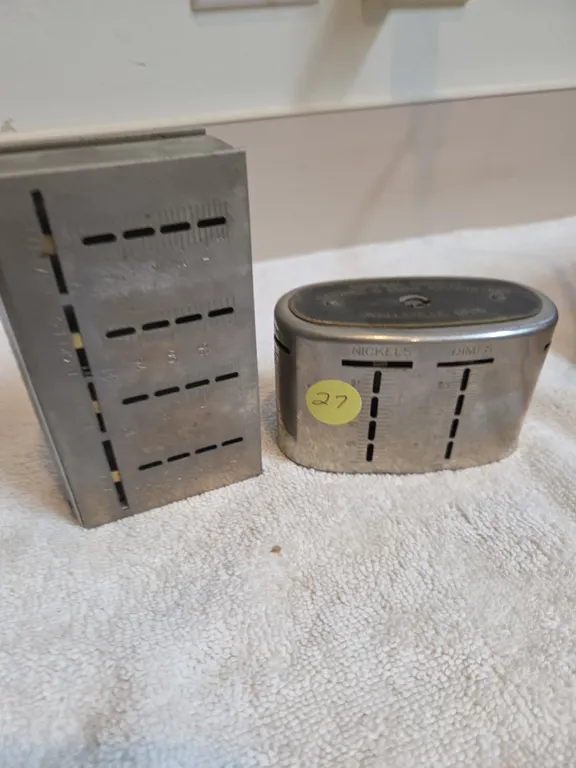 Vintage metal coin counter banks with bank advertisements