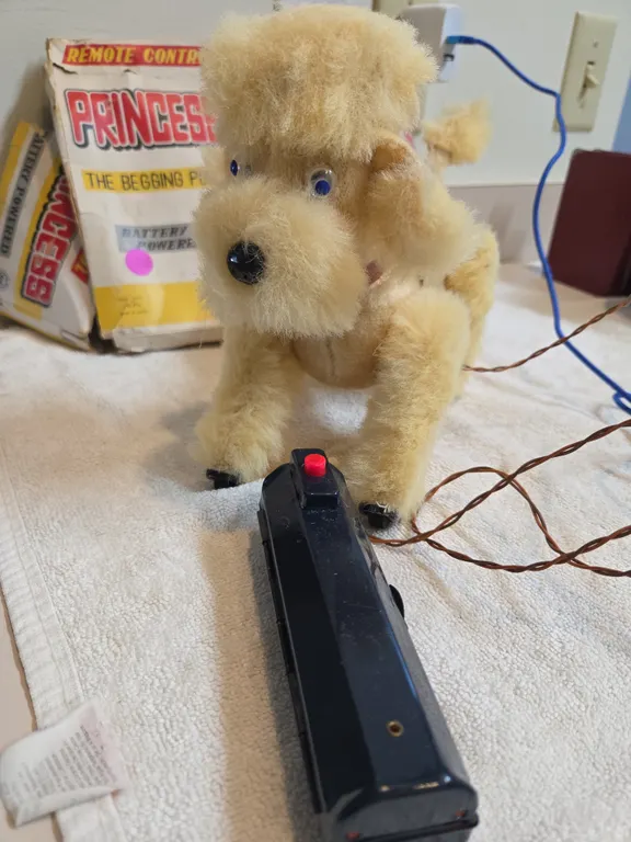 Vintage remote control princess the begging poodle. Tail is broken