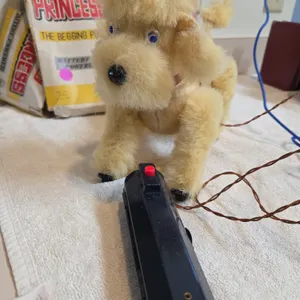 Vintage remote control princess the begging poodle. Tail is broken