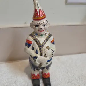 Antique cast iron circus clown or jester penny coinbank. Manufactured by the a f c williams company,