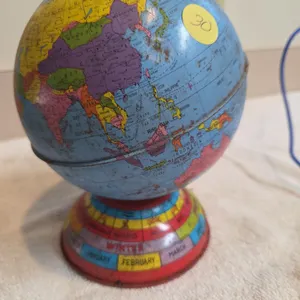Vintage metal globe coin bank