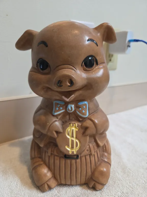 A twin winton vintage brown ceramic pig piggy bank manufactured in california during the 1960s