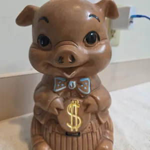 A twin winton vintage brown ceramic pig piggy bank manufactured in california during the 1960s