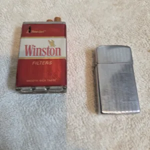 Vintage novelty, cigarette pack glider styled after winston filters. Vintage metal pocket, lighter z