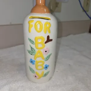 Vintage ceramic baby bottle coin bank