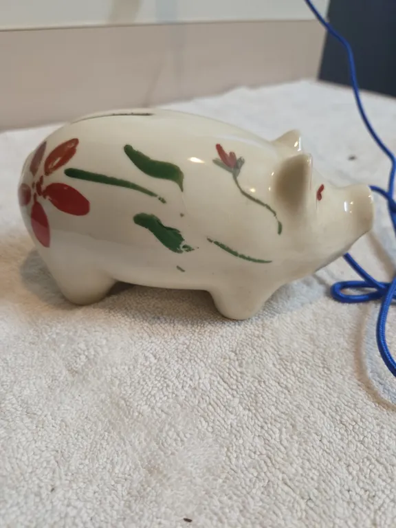 Vintage hand painted ceramic piggy bank, decorated with simple folk art floral motif