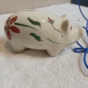 Vintage hand painted ceramic piggy bank, decorated with simple folk art floral motif